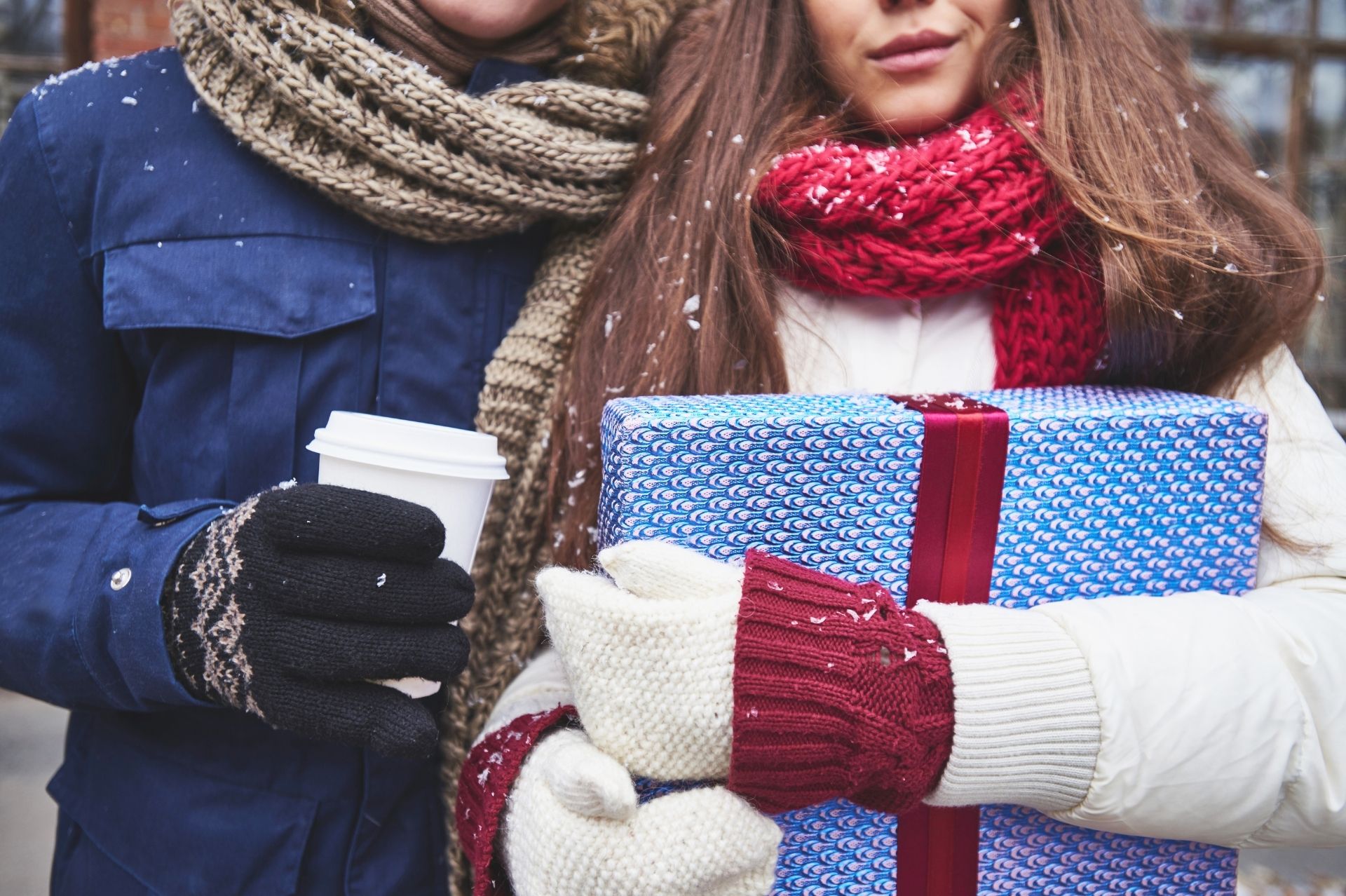 A person holding a wrapped present